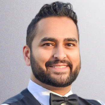 headshot of dr priyesh tawar smiling and wearing a bowtie