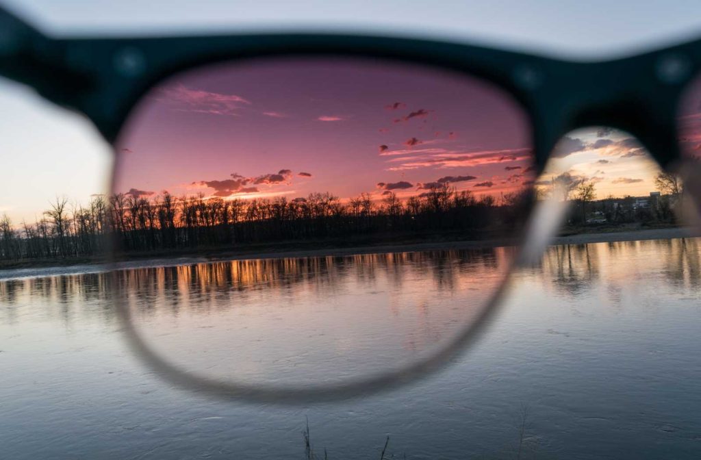 polarized sunglasses filtering glare off the surface of water and trees