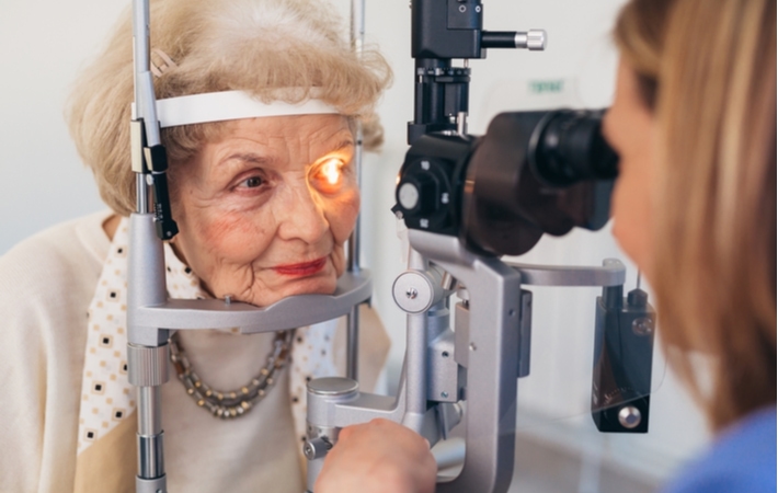A senior woman at her optometrist getting her regular eye exam