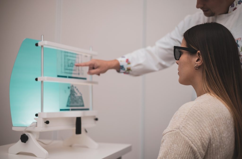 A woman undergoing vision therapy to help reduce the symptoms of her astigmatism