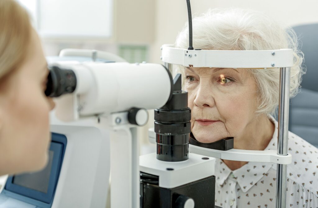 Close-up of an older adult woman undergoing a slit-lamp exam